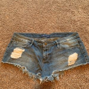 Distressed GUESS denim shorts